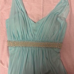 A soft blue/green dress with a flowing skirt and a flattering fitted bodice NEW